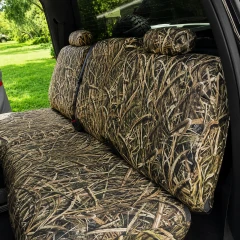 Mossy Oak Waterproof Camo seat covers on truck rear bench, Shadow Grass Blades camo on backrest, cushion, and two headrests.