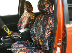 Moon Shine Waterproof Camo Seat Covers (Wildfire Solid) installed on front seats, vibrant orange camo custom-fit look.