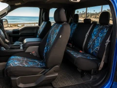 Moon Shine Waterproof Camo seat covers on Ford truck front and rear, blue camo centers with black bolsters and headrests.