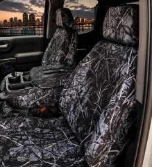 Moon Shine Waterproof Camo seat covers on truck 40/20/40 bench, black-and-white branch camo on seats, console, and headrests.