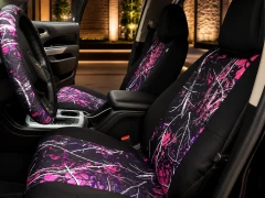 Moon Shine Waterproof Camo seat covers on front buckets, pink camo inserts with black bolsters and matching wheel wrap.