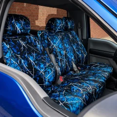 Moon Shine seat covers on truck front bench, blue branch camo covering seats and headrests in a matching blue truck.
