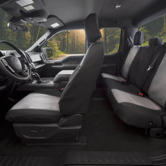 Atomic Pro-Tect Seat Covers installed in a truck, two-tone black and gray heavy-duty fabric for front and rear seats.