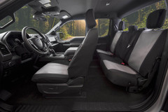 Atomic Pro-Tect Seat Covers installed in a truck interior, durable two-tone black and gray front and rear coverage.