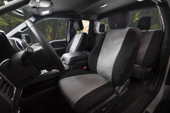 Atomic Pro-Tect Seat Covers front seat view in a truck, durable two-tone gray and black protection with a custom- Image 600 denier waterproof polyester/40 cotton blend.