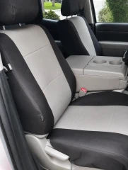 Atomic Pro-Tect seat covers on front buckets, black bolsters with gray stitched centers and airbag-compatible side tag.