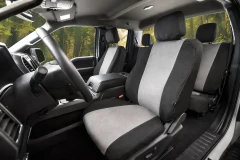 Atomic Pro-Tect Seat Covers front seat view in a truck, durable two-tone gray and black protection with a custom- Image 600 denier waterproof polyester/40 cotton blend.