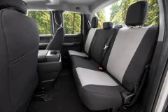 Atomic Pro-Tect Seat Covers on rear truck seats, tailored two-tone black and gray finish for maximum protection.