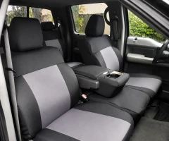 Atomic Pro-Tect seat covers on truck front and rear, black sides with light gray center panels on buckets and bench.
