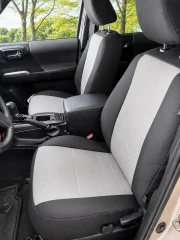 Atomic Pro-Tect seat covers on front buckets, charcoal sides with light gray centers, headrests, and airbag tag.