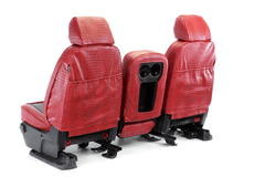 Rear view of Exotic Seat Covers in red crocodile skin texture, showing built-in storage pockets and console access.