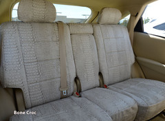 Exotic Seat Covers (Bone Croc) on rear bench seat, featuring a full-coverage cream crocodile skin embossed pattern.
