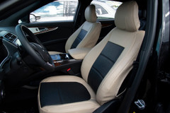 Exotic Seat Covers on front seats, tan ostrich texture with black inserts for a custom-fit luxury interior.