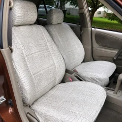 Exotic Seat Covers in Bone Croc color, textured crocodile-style front seat covers for car upholstery, durable comfort.