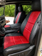 Exotic Seat Covers installed on front seats, featuring a bold red and black crocodile skin texture for a custom-fit luxury look.