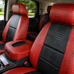 Exotic seat covers on front buckets and console, red crocodile emboss with black center inserts on backrests and cushions.