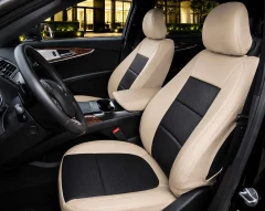 Exotic Seat Covers on front seats, tan ostrich texture with black inserts for a custom-fit luxury interior.