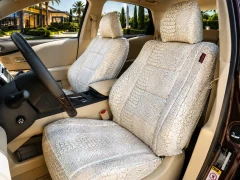 Exotic Seat Covers (Bone Croc) installed on a front seat, featuring a clean cream-colored crocodile skin embossed pattern.