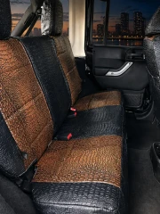 Rear bench seat outfitted with matching Midnight Croc and Java Croc exotic seat covers, showcasing the textured crocodile pattern and precise fit for a complete interior transformation.