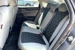 Sof-Touch Leatherette Seat Covers installed in a luxury vehicle, black and gray leatherette with a sleek custom-fit finish.