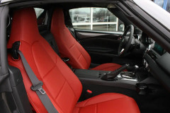Sof-Touch Leatherette Seat Covers installed in a sports car, premium red leatherette for a sleek custom-fit look.
