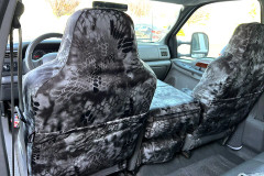 Luxury Line Kryptek camo seat covers on 40/20/40 front seats with console, Typhon grey-black pattern and rear map pockets.