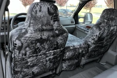 Luxury Line Kryptek camo seat covers on 40/20/40 front seats with console, Typhon grey-black pattern and rear map pockets.