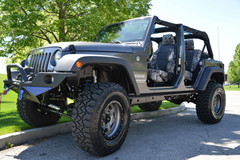 Luxury Line Kryptek Camo Seat Covers installed in a Jeep, Kryptek Typhon camo with black center panels.
