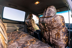 Luxury Line Realtree Camo Seat Covers side view seats with full camo coverage.