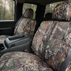Luxury Line Realtree Camo Seat Covers installed on front seats (waterfowl-style camo), durable full-coverage protection.