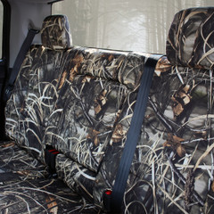Luxury Line Realtree Camo Seat Covers installed on rear bench seat (close view), waterfowl-style camo pattern and fit.