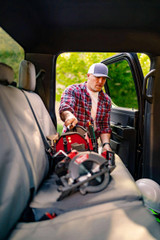 Man getting into a truck equipped with durable Tan Cordura seat covers, showcasing the custom fit and rugged design for outdoor lifestyles.