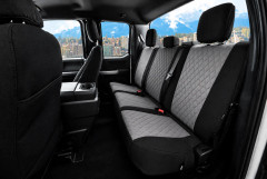 Waterproof CORDURA seat covers on truck rear bench, gray diamond-quilted centers with black bolsters and three headrests.