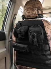 Rear view of a front seat equipped with a Kryptek® Camo cover in a desert tan pattern, featuring an integrated tactical MOLLE system with multiple utility pouches for organized storage.