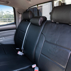 Luxury Line Carbon Fiber Seat Covers installed on front and rear seats in a truck, showing durable carbon fiber textured material and custom fit.