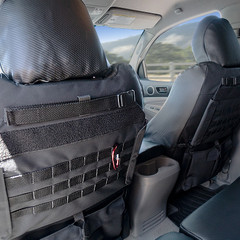 Close-up of Luxury Line Carbon Fiber Seat Covers featuring an optional Tactical MOLLE System for organized gear storage system on the seatback.