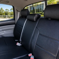 Luxury Line Carbon Fiber Seat Covers installed on front and rear seats in a truck, showing durable carbon fiber textured material and custom fit.