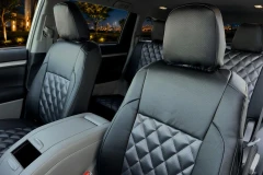 Luxury Line Carbon Fiber seat covers shown on front and rear seats, carbon bolsters and diamond-quilted black center inserts.