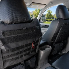 Close-up of Luxury Line Carbon Fiber Seat Covers featuring an optional Tactical MOLLE System for organized gear storage system on the seatback.