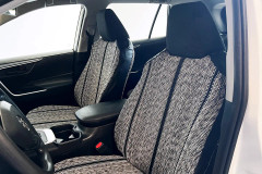 Luxury Line Saddle Blanket seat covers on front buckets, salt-and-pepper weave with twin black stripes and black bolsters.
