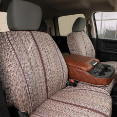 Luxury Line Saddle Blanket seat covers on front buckets, heathered weave with brown stripes and leatherette console armrest.