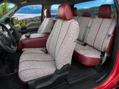 Interior view of Luxury Line Saddle Blanket Seat Covers on front and rear seats, woven fabric with dark red trim.