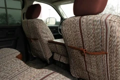 Luxury Line Saddle Blanket seat covers on front backs, heathered weave with brown stripes and leatherette storage pockets.