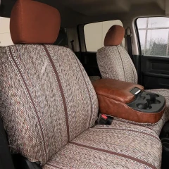 Luxury Line Saddle Blanket seat covers on front buckets, heathered weave with brown stripes and leatherette console armrest.