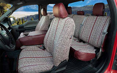 Interior view of Luxury Line Saddle Blanket Seat Covers on front and rear seats, woven fabric with dark red trim.
