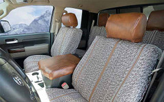 Luxury Line Saddle Blanket Seat Covers installed in a truck, featuring woven inserts with premium brown leatherette.