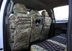 Original MultiCam Seat Covers with a rear Tactical MOLLE System, gear straps, and storage pockets shown on the back of front truck seats.