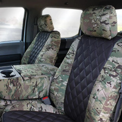 Front bucket seats and center console cover with Luxury Line MultiCam Seat Covers, featuring black quilted inserts and MultiCam camo trim.