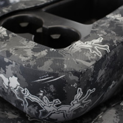 Close-up of the custom-fit console cover for Luxury Line Viper Camo Seat Covers, with precise openings for cupholders.