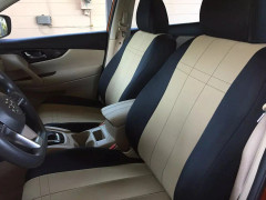 Custom two-tone neoprene seat covers in tan and black installed on front bucket seats, complementing the vehicle's beige interior while adding water resistance.